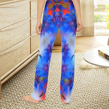 Girls’ butterfly lounge pants with blue butterfly and garden design, soft brushed polyester, elastic waistband, part of Paisley’s Corner Collection, ideal for sleepovers and cozy home wear, girl in butterfly lounge pants - back view